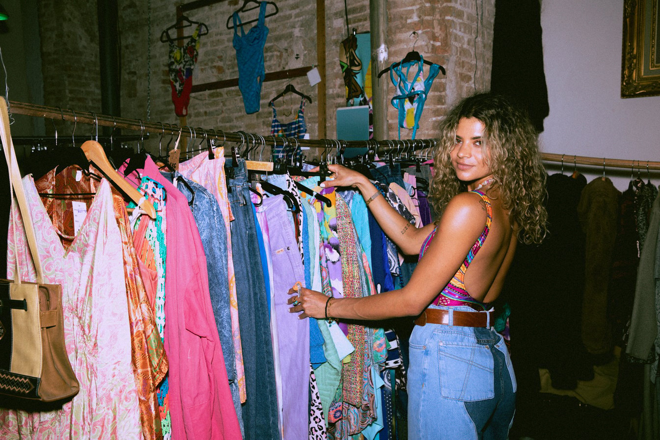 Woman Thrifting Clothes in a Vintage Shop